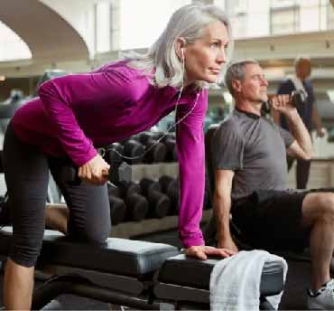 woman and man using free-weights