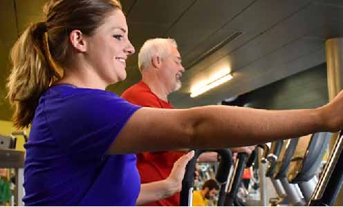 woman and man on ellipticals
